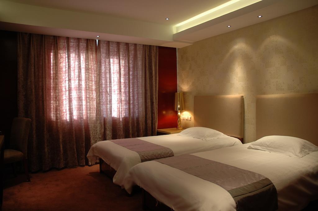 Harbin Yakelai Holiday Hotel Rum bild